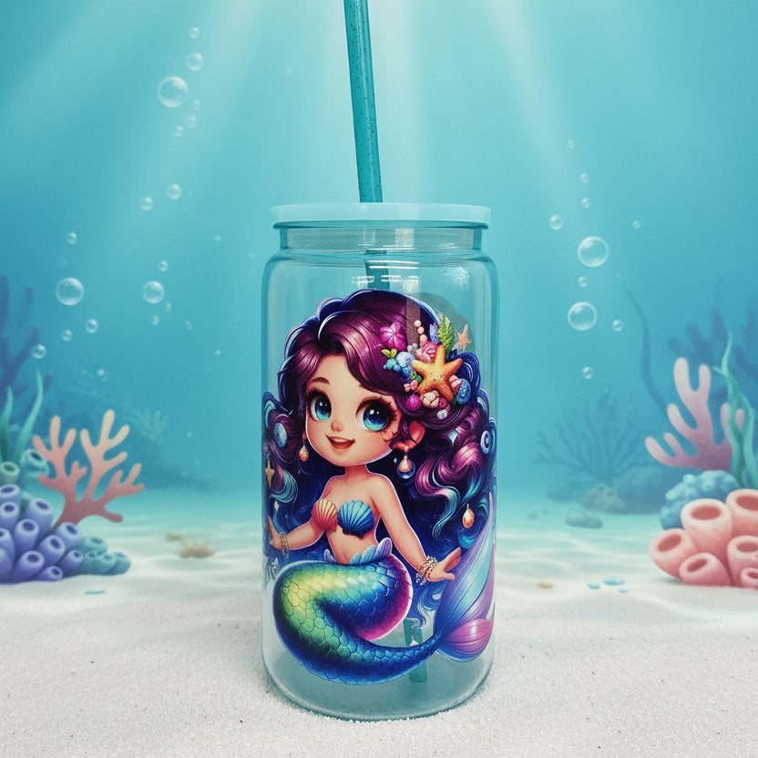 Tumbler with a mermaid design on a white surface