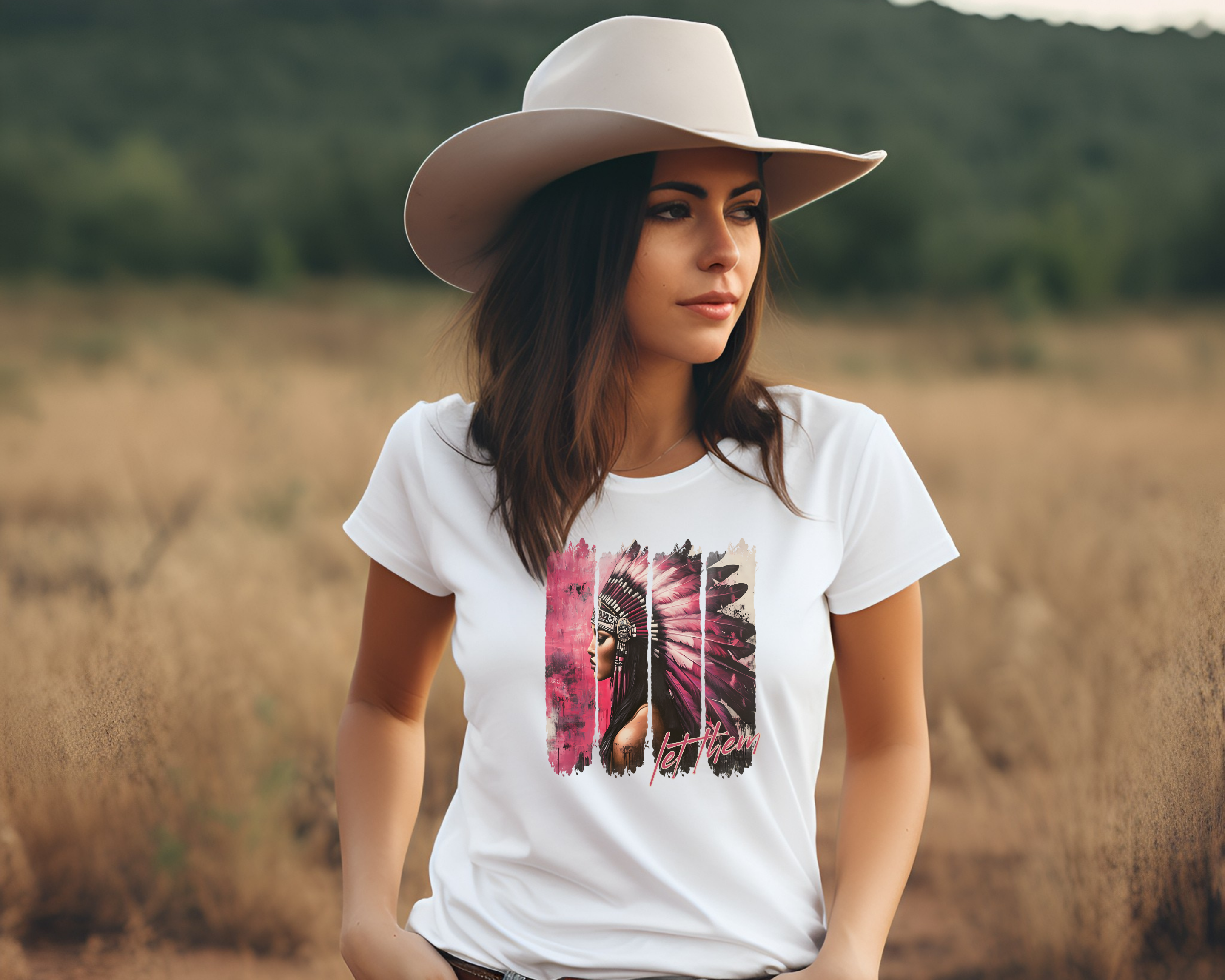 Woman wearing a white t-shirt with a graphic design in a field