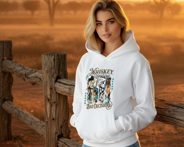 Woman wearing white hoodie with bold graphic Whiskey, cowboys and bad decisions

