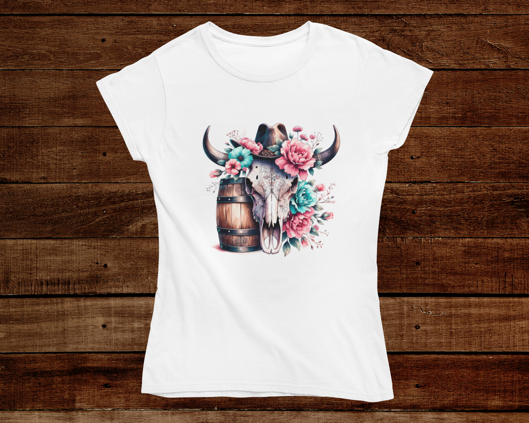 White t-shirt with a bull skull and flowers design on a wooden background