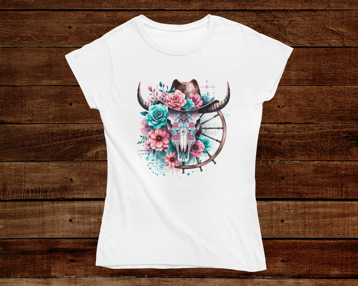 White t-shirt with a colorful bull skull design on a wooden background