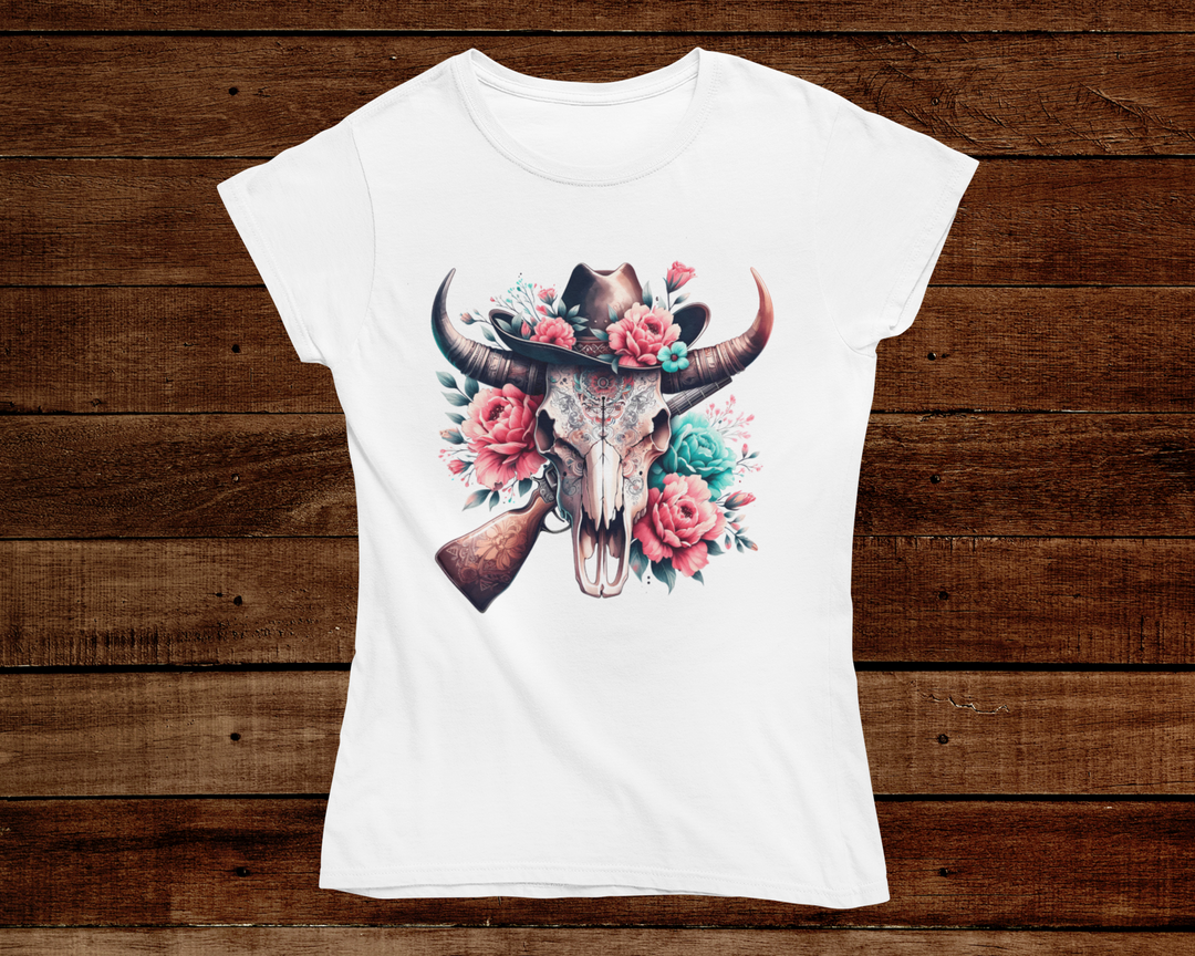 White t-shirt with a bull skull and floral design on a wooden background