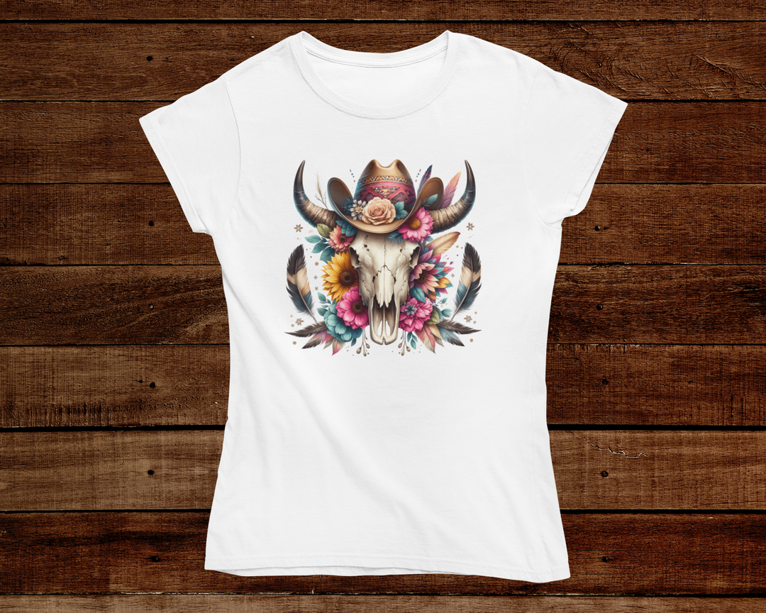 White t-shirt with a colorful bull skull design on a wooden background
